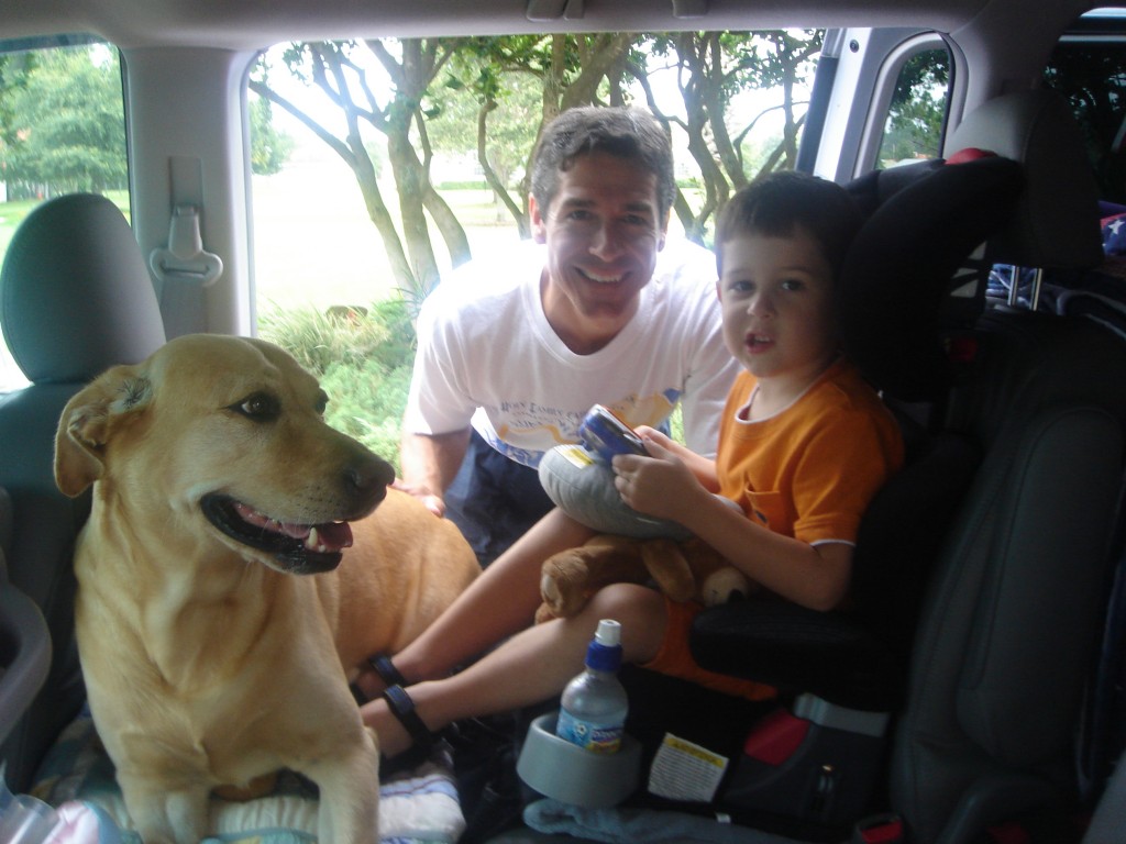 family and dog in mini van