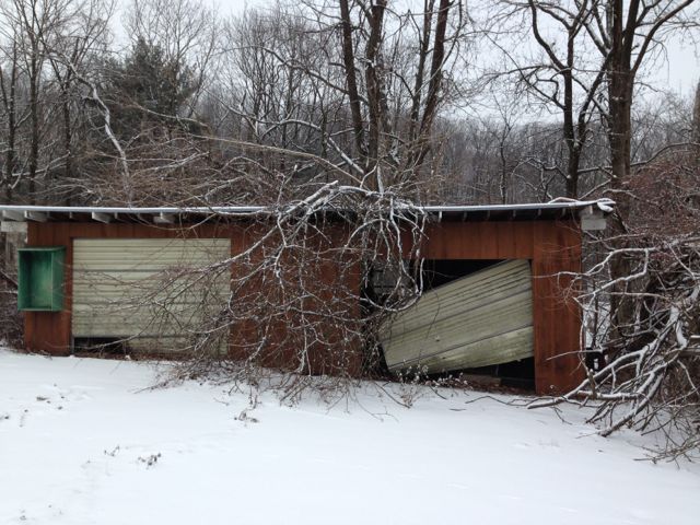 Old, neglected garage in winter
