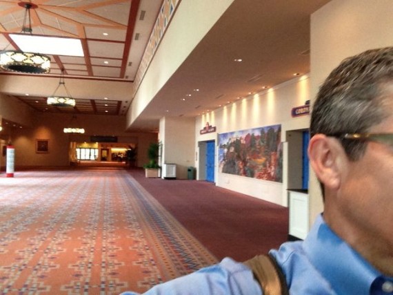 Business man rushing through convention center