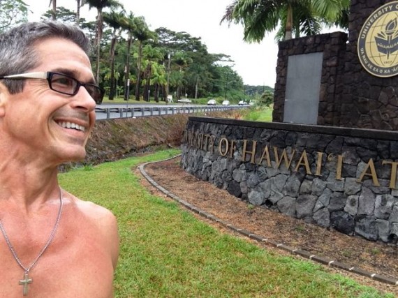 jeff noel in front of University of Hawaii Hilo entrance sign