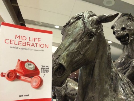 Mid Life Celebration book at Calgary airport horse sculpture
