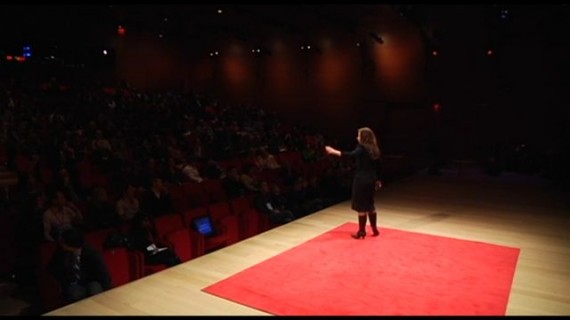 TED talk stage with female speaker