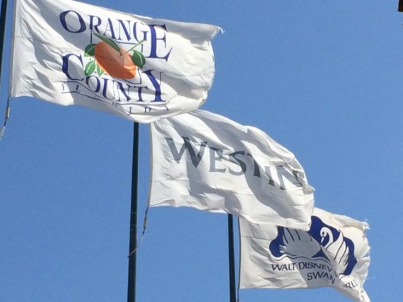 Three Orange County Florida Flags blowing in the wind