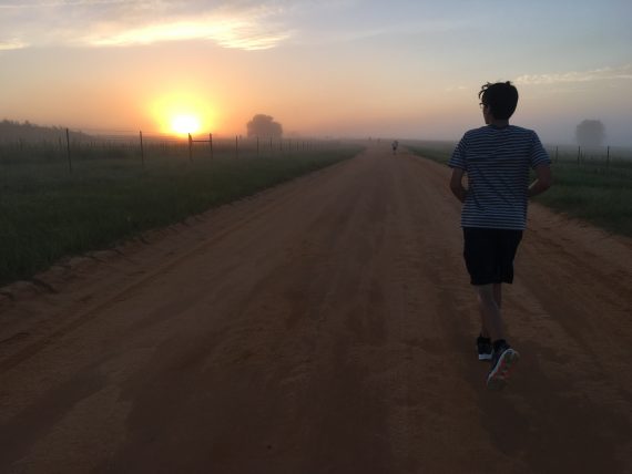 Lone runner at sunrise
