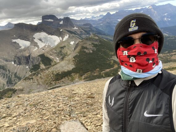 jeff noel on mountain side, wearing a mask