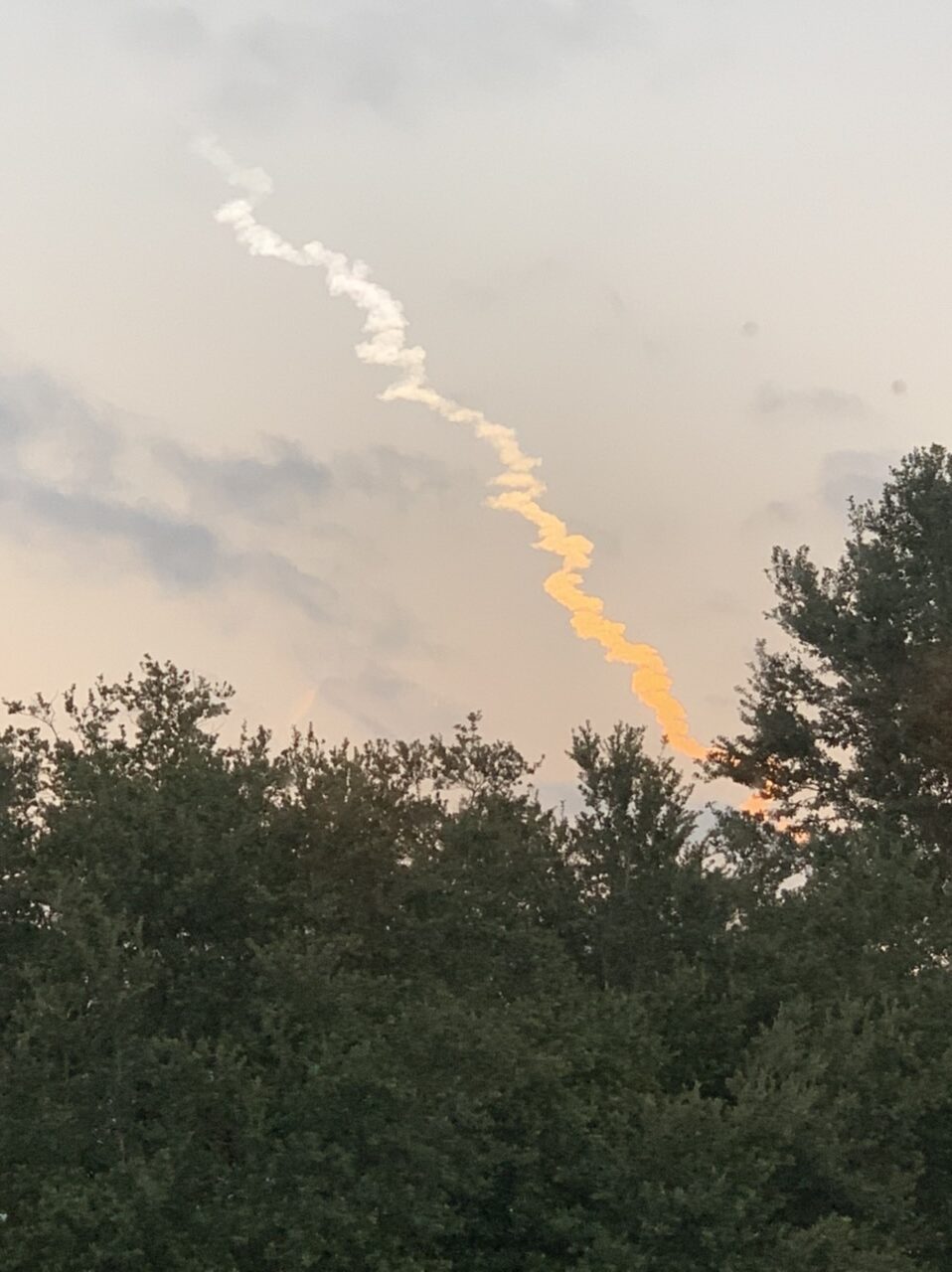 Rocket launch smoke trail in sky