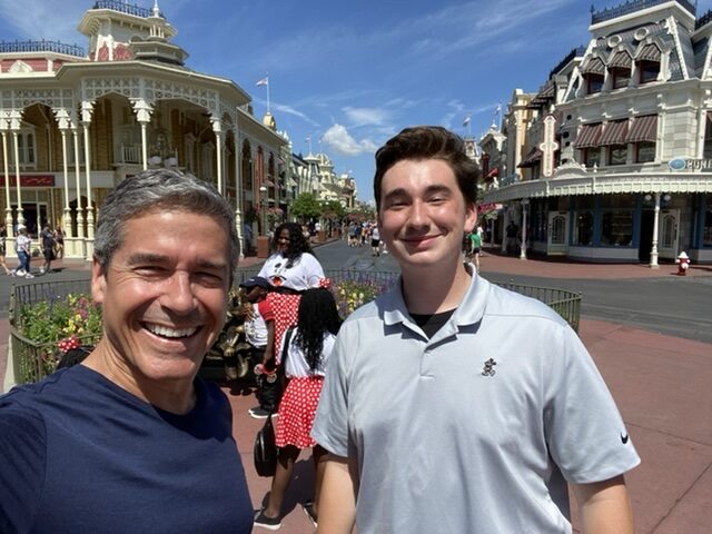 retired man and college student in Magic Kingdom