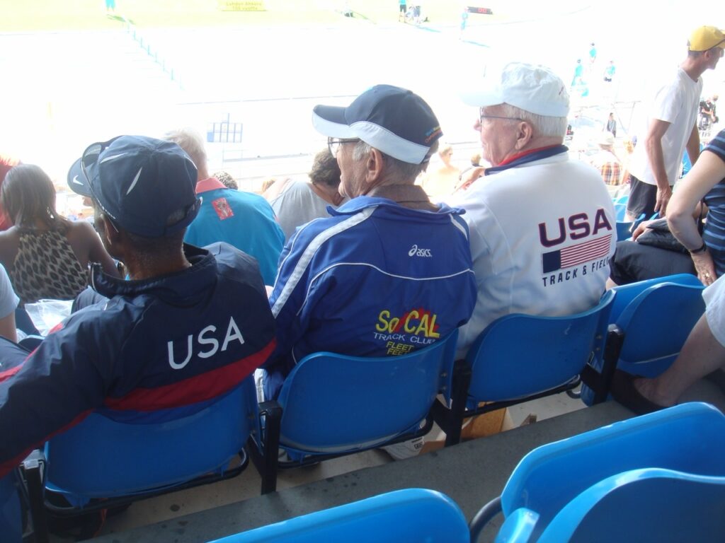 three men wearing USATF jackets