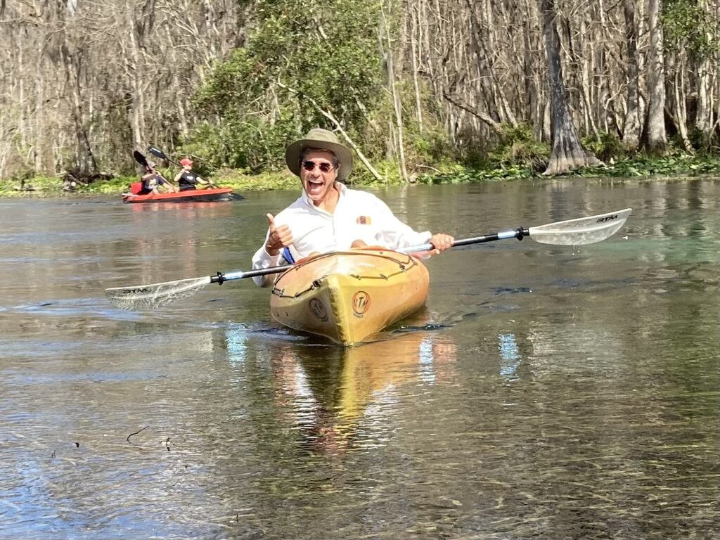 man in a yellow kayak