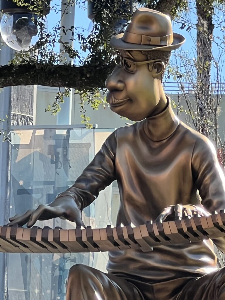 bronze stature of Joe from Pixar Soul