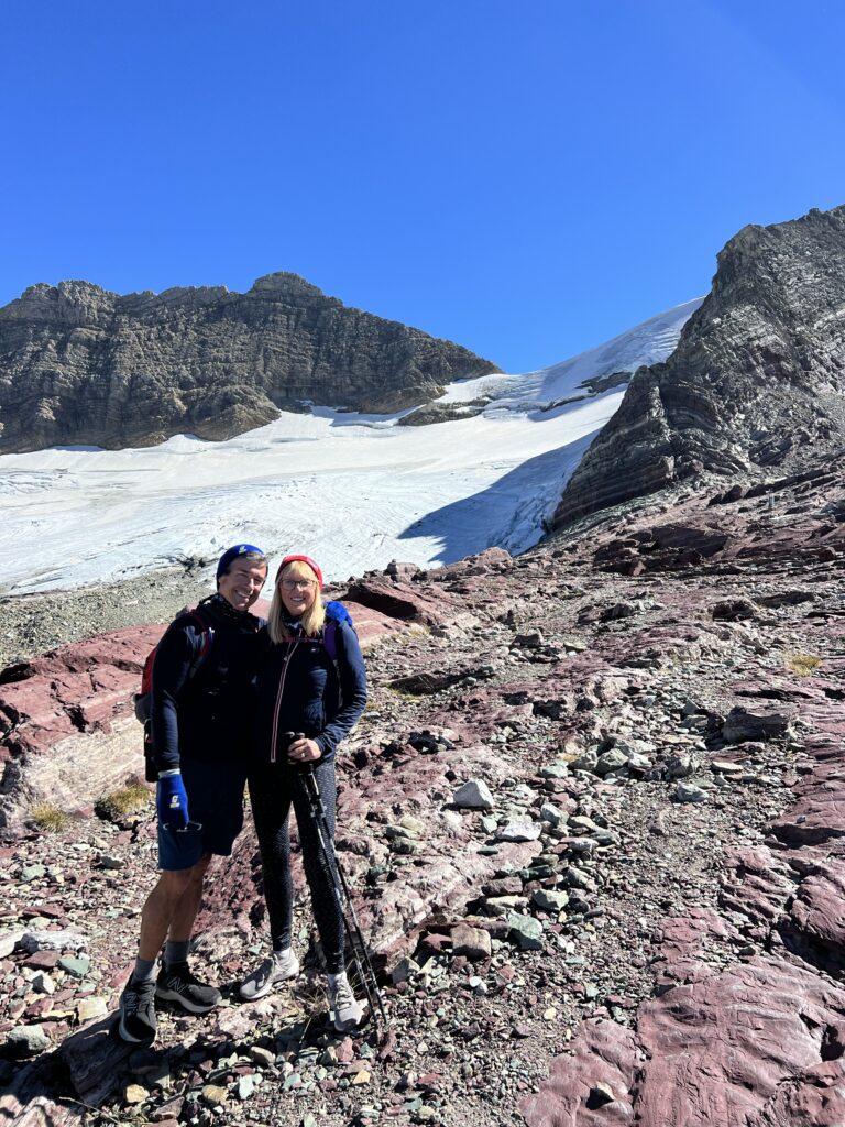 Two people next to a Glacier