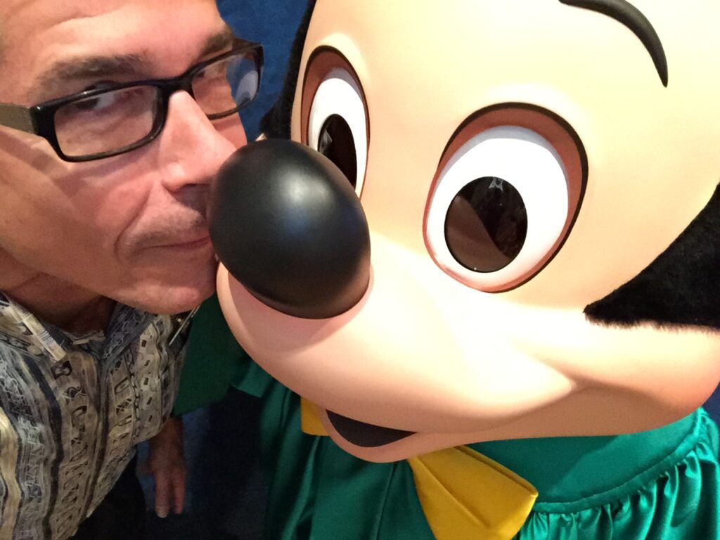 Disney Institute speaker Jeff Noel with Mickey Mouse