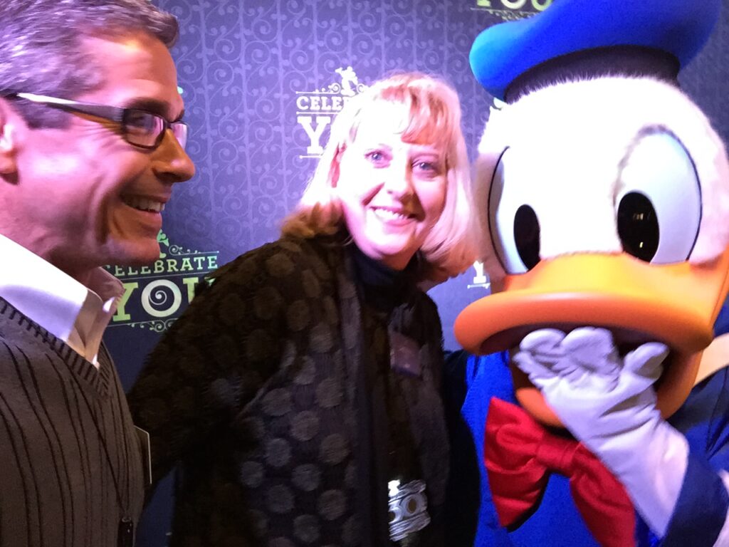 Disney leaders Cheryl and Jeff Noel with Donald Duck