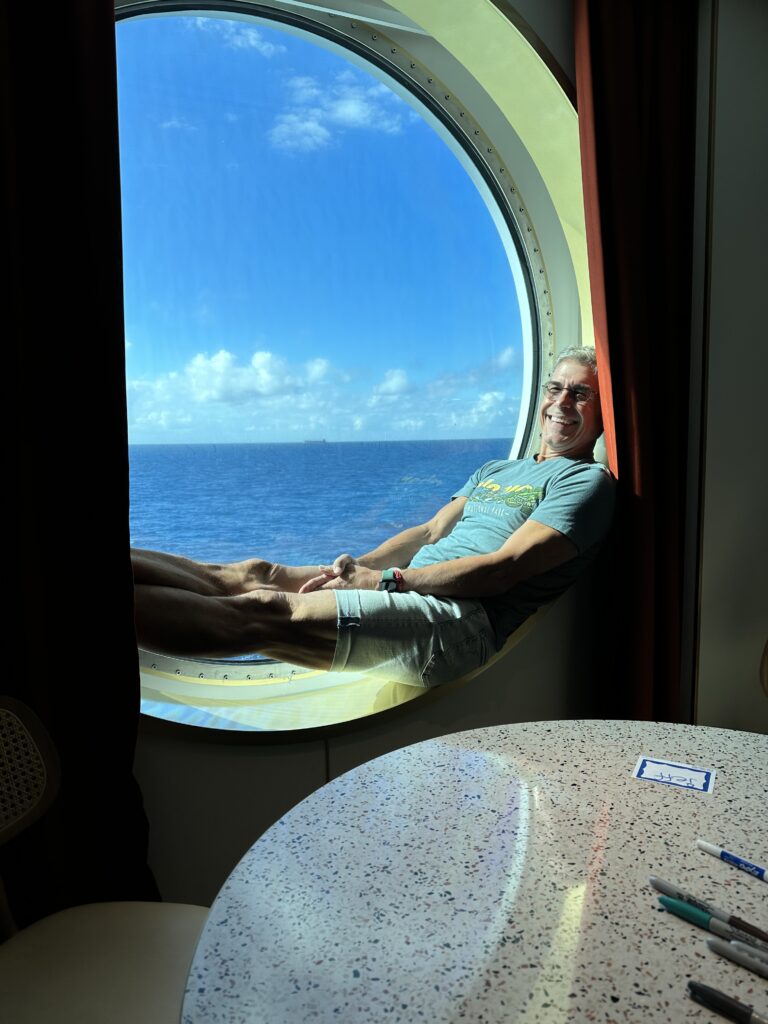 Man sitting on cruise ship