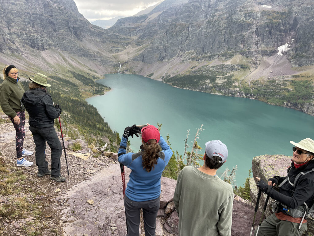 group of hikers near a mountain lake