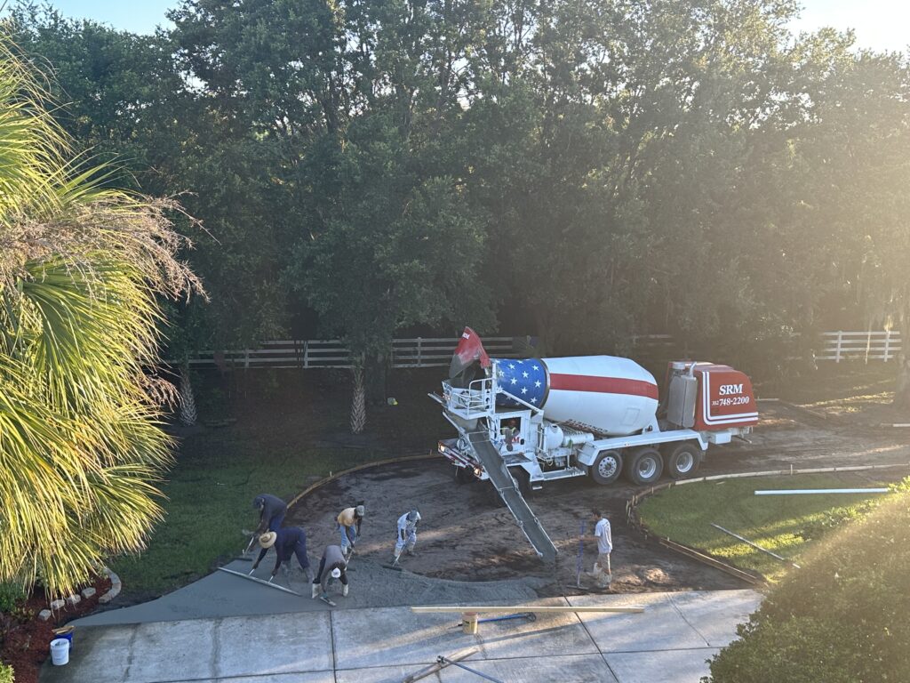 Concrete crew pouring homeowner driveway