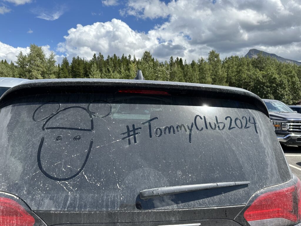Message written on a dirty windshield