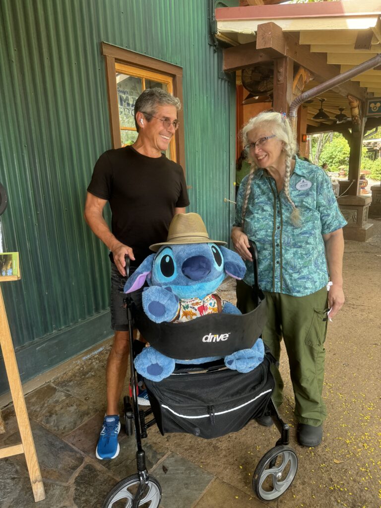 two people smiling at Disney