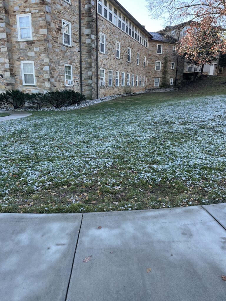College campus building with light snow
