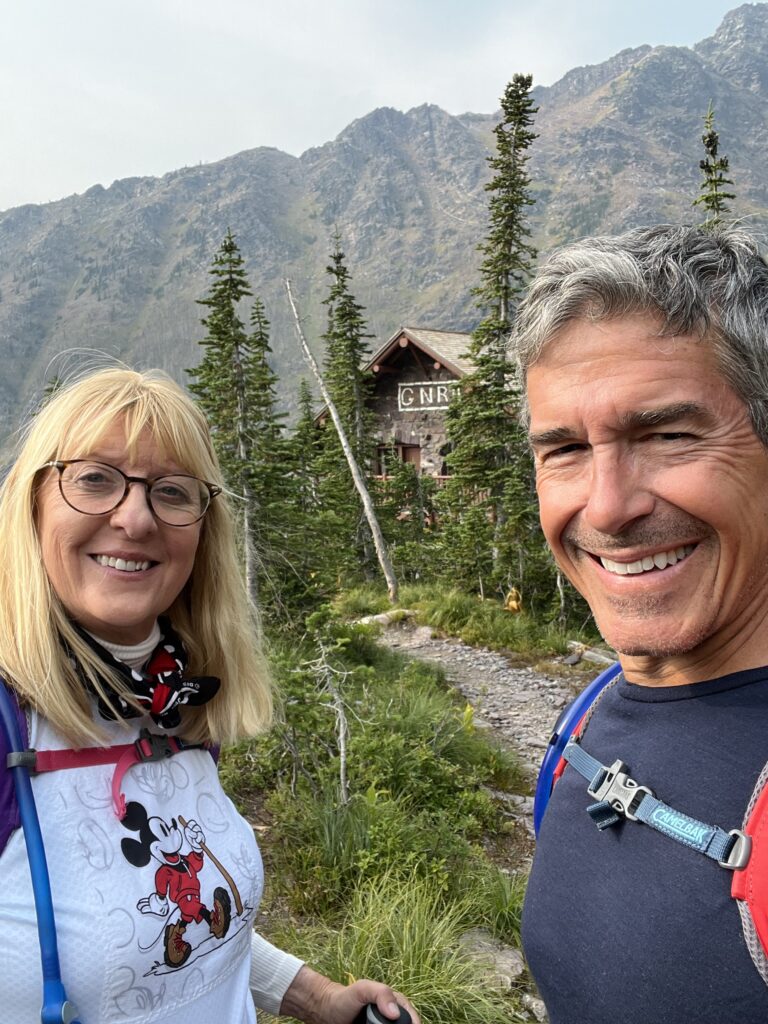 two hikers in mountains
