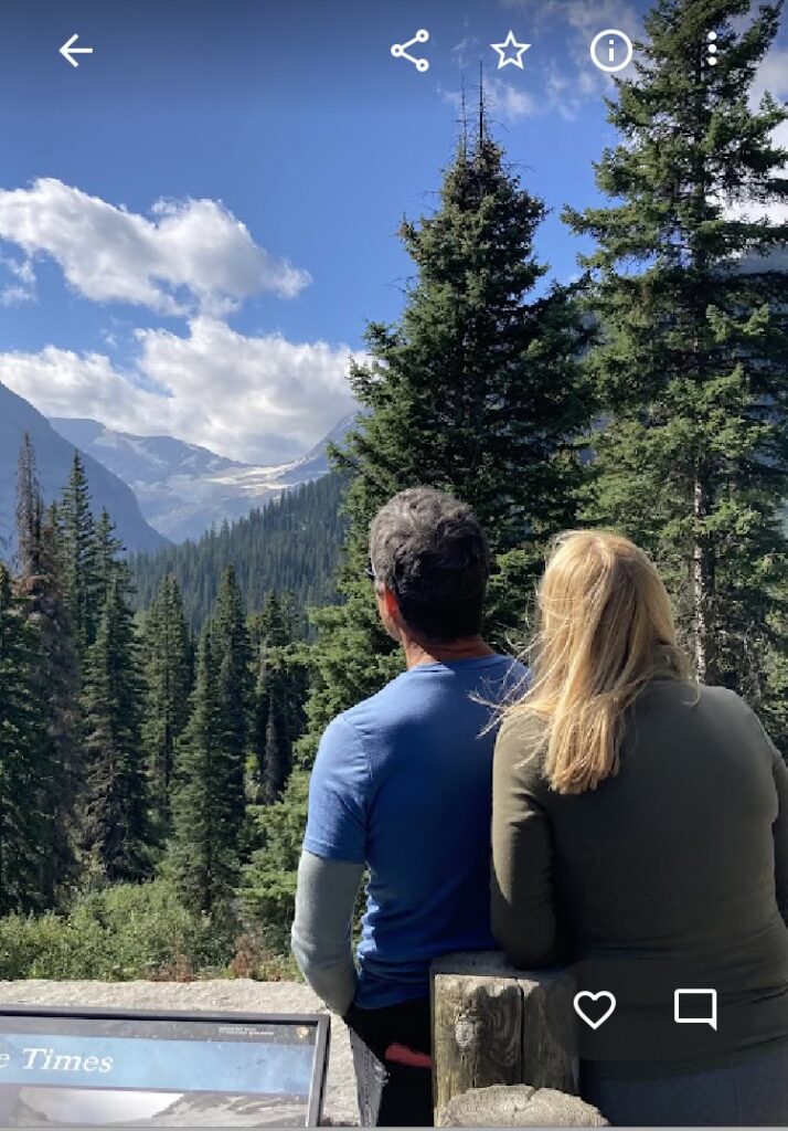 Two people looking at the mountains