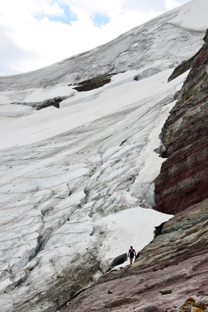 man next to glacier