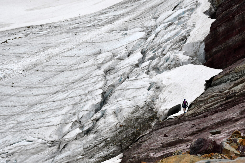 man next to glacier