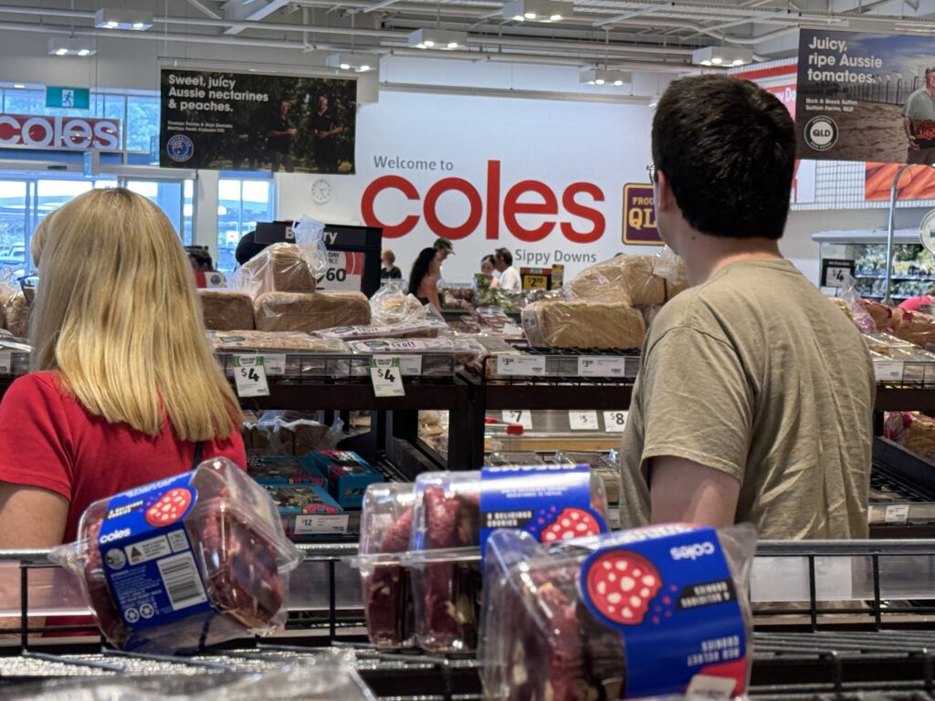 Two adults in a grocery store