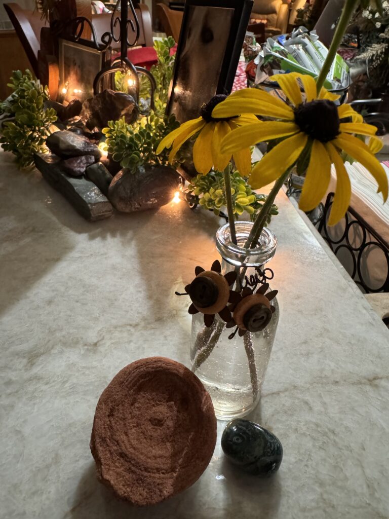 some black-eyed Susans in a bottle