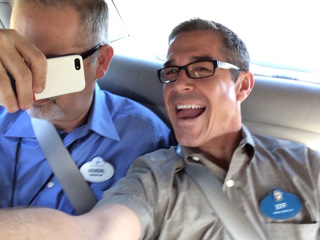 Disney Keynote Speaker jeff noel having fun in a cab