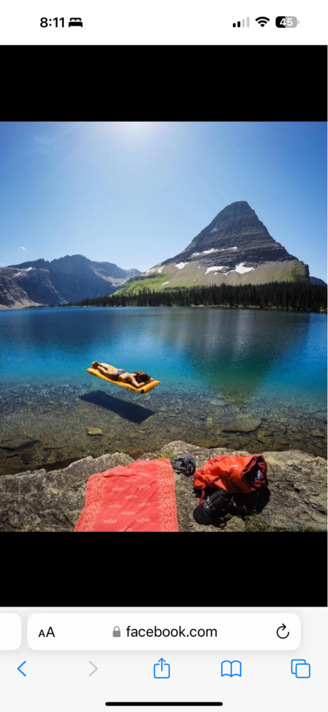 Person on raft on mountain lake