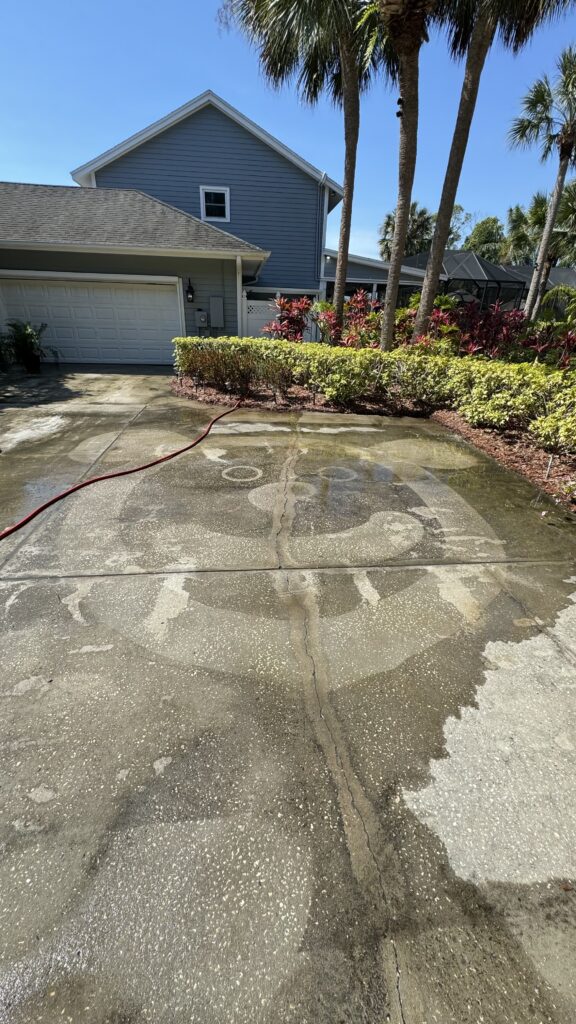 Pressure washing a driveway