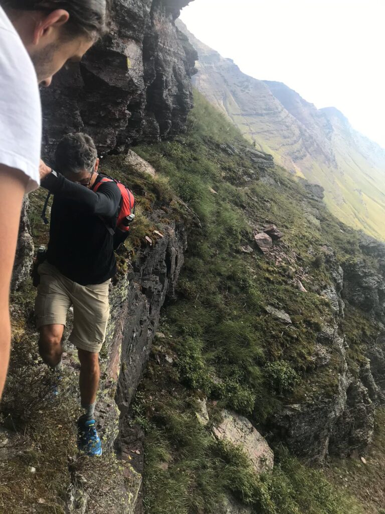 Hikers on a cliff wall