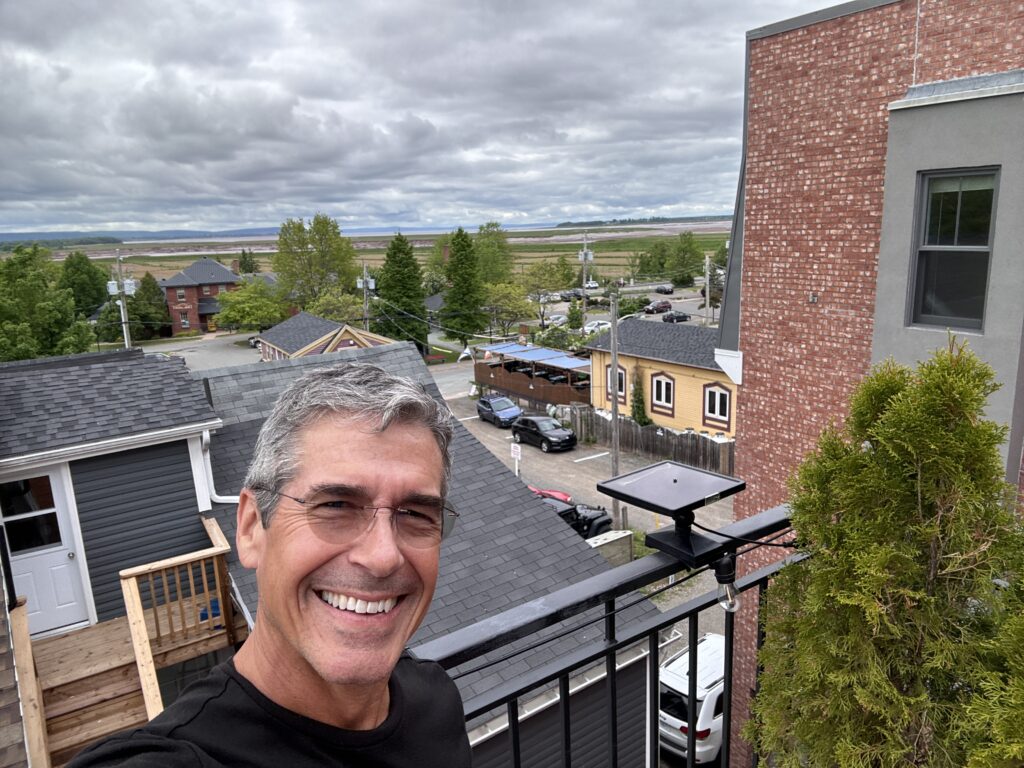 Man on a porch balcony 