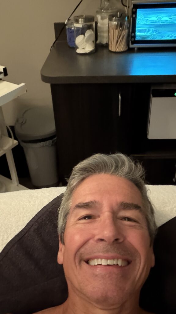 man's face in dim room