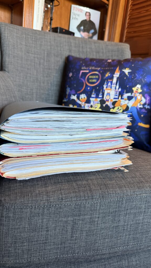 pile of file folders on home office chair