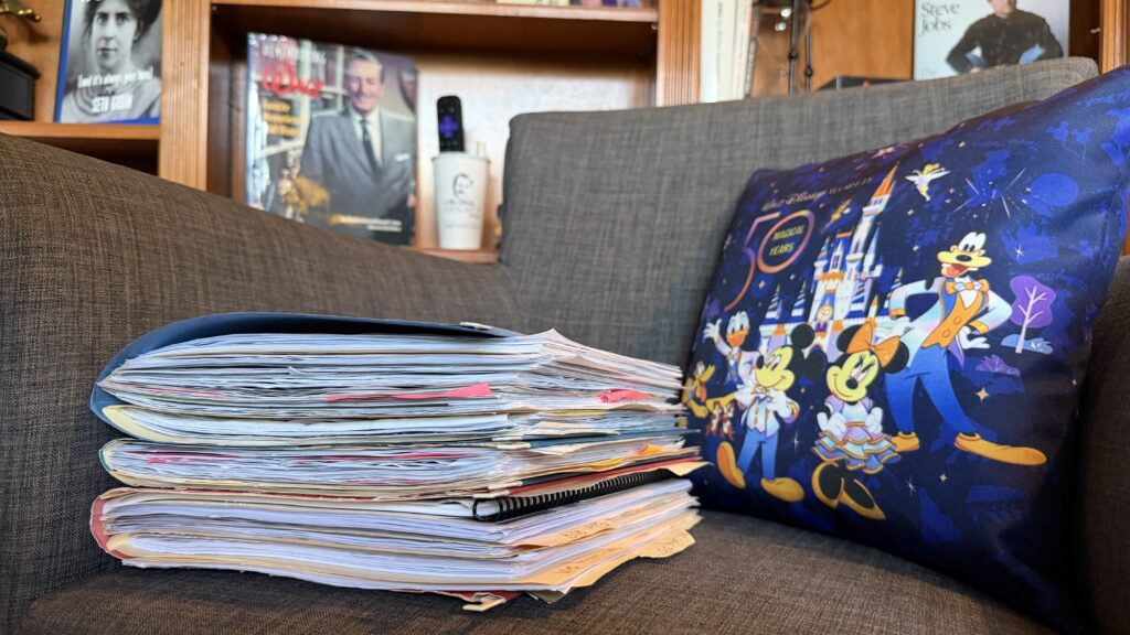 pile of file folders on an office chair